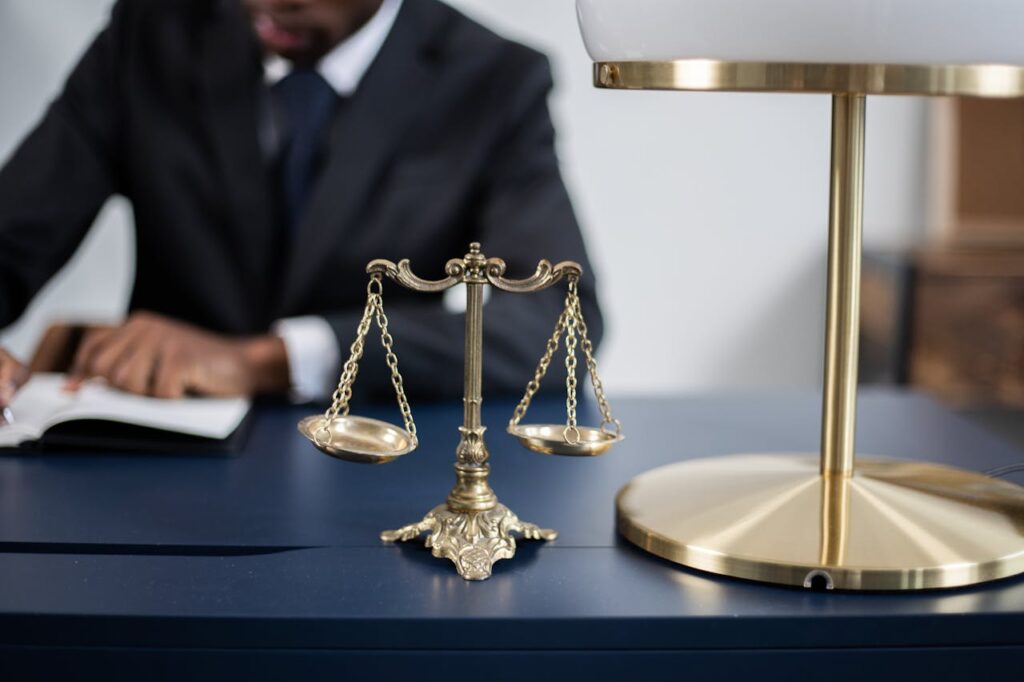 The scales of justice on the desk of a FINRA arbitration attorney