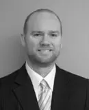 Headshot of D. Daxton White, a securities lawyer and managing partner of The White Law Group