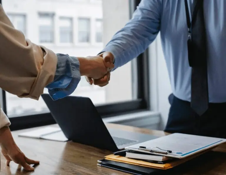 A person shaking hands with a securities arbitration attorney