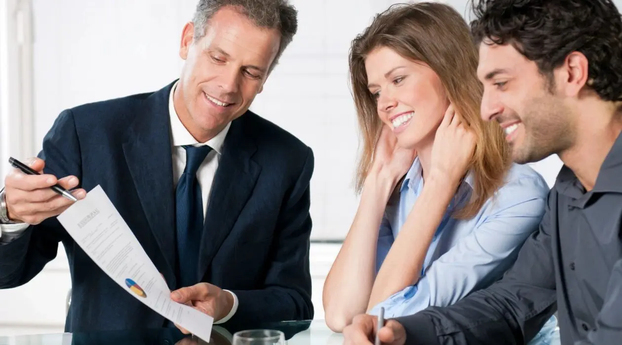 A person explaining what FINRA Rule 4512 is to two adults
