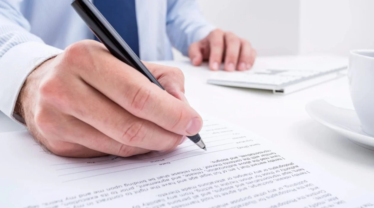 A person writing down information for securities fraud attorneys in Ames, Iowa