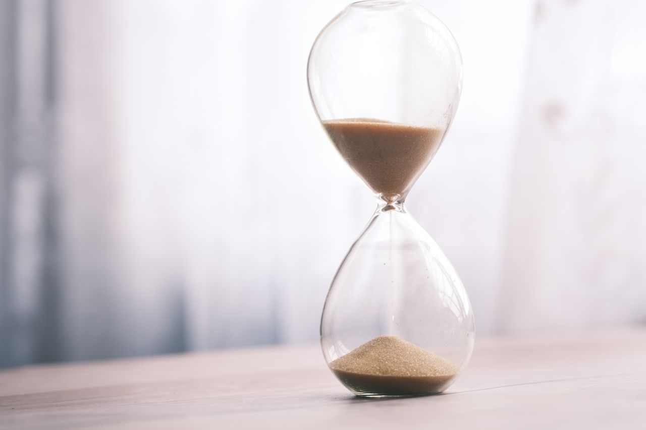 An hourglass on a table