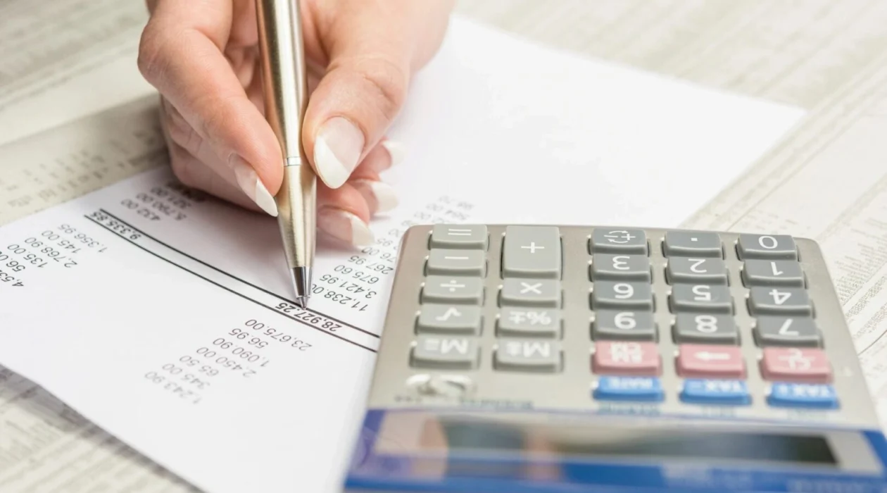 A hand holding a pen on a document about securities arbitration