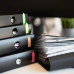 A stack of binders, illustrating what evidence supports your FINRA claim
