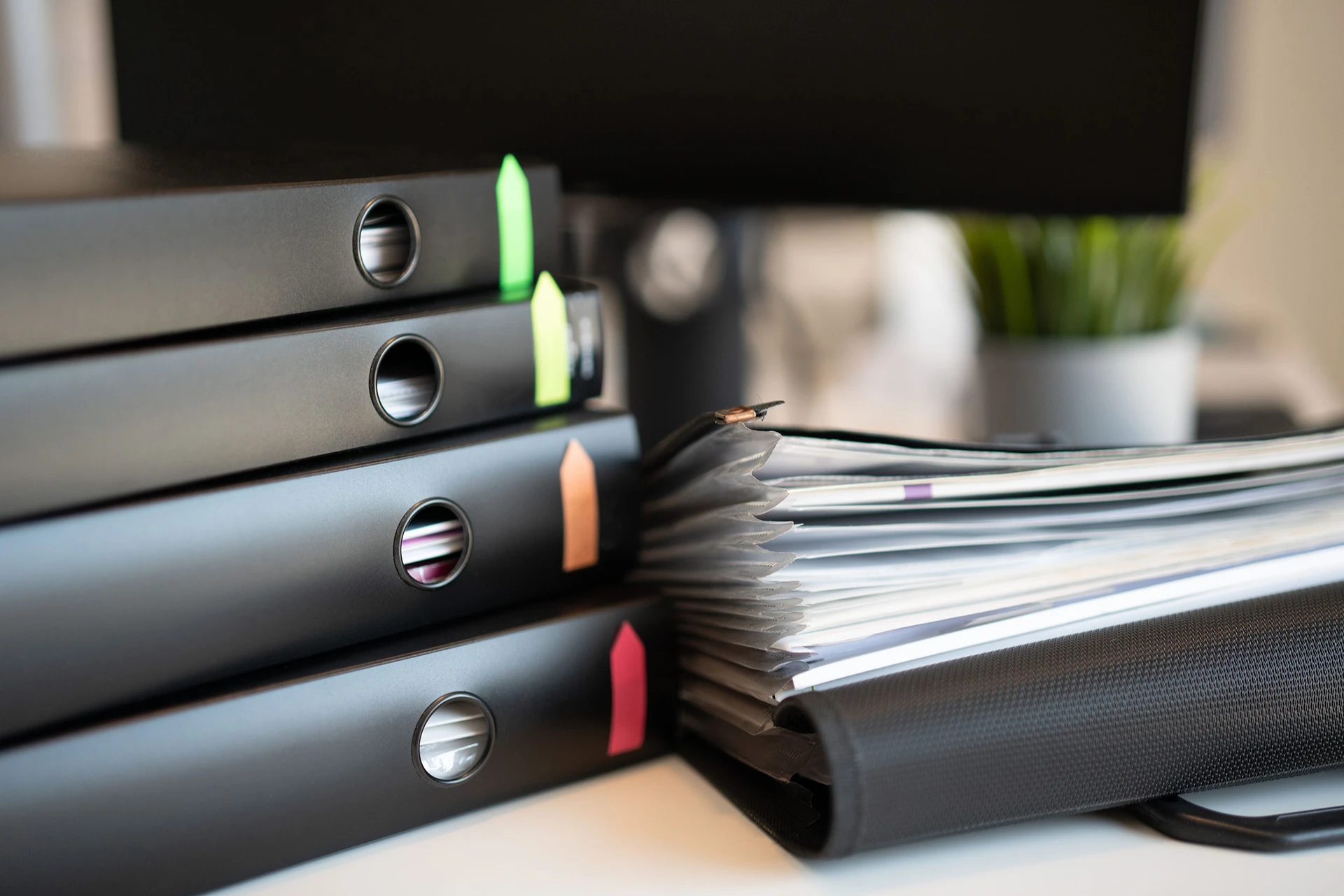 A stack of binders, illustrating what evidence supports your FINRA claim